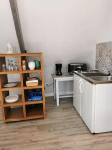 a kitchen with a sink and a counter top at Catherine et Serge in Genêts