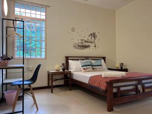 Ένα ή περισσότερα κρεβάτια σε δωμάτιο στο EE's Sunset House - Homestay 3 min walk to beach