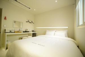 Ένα ή περισσότερα κρεβάτια σε δωμάτιο στο Hotel MARE