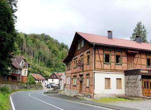 a wooden house on the side of a road at Kreuztal 3 in Neuwerk