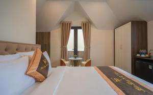 Postel nebo postele na pokoji v ubytování BẢO DUY HOTEL 5