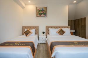 Postel nebo postele na pokoji v ubytování BẢO DUY HOTEL 5