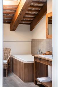 a bathroom with a tub and a sink at Castello di Buttrio in Buttrio