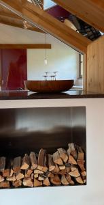 a counter with a pile of wood and a bowl at Apartment Cesa Collina Superior in Ortisei