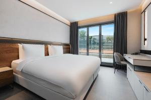 Postel nebo postele na pokoji v ubytování INVENTIST Hotel Sports Academy Istanbul