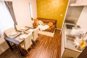 a small apartment with a table and a kitchen at Tokyo Private villa/near station/Ginza/Asakusa/Sky Tree/Louis House in Tokyo +42 photos