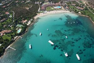 an aerial view of a beach with boats in the water at Domus Corallia-Luxury Rooms in Porto Rotondo