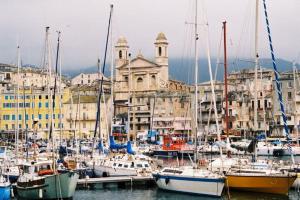 a group of boats docked in a harbor with buildings at Bastia Room in Bastia