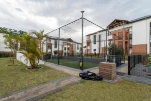 a basketball hoop with a helmet laying on the grass at BALLITO HILLS , 2 bedroom apartment in Ballito +48 photos