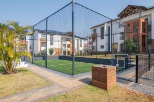 a batting cage with a tennis court in a building at BALLITO HILLS , 2 bedroom apartment in Ballito