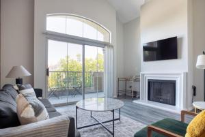 a living room with a couch and a fireplace at Century City 2br w bbq roof lounge nr mall LAX-1118 in Los Angeles
