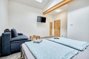 Letto o letti in una camera di Apartmány Svatošské skály