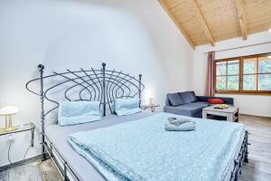 Letto o letti in una camera di Apartmány Svatošské skály