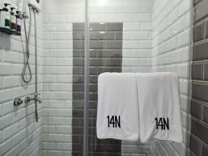 a towel with the word jam written on it in a bathroom at Cozy and Spacious Condo Unit with Free Netflix in Manila