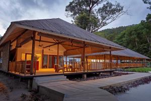 a large wooden house with a large deck at ISLAND CENTER POINT in Koh Rong Sanloem