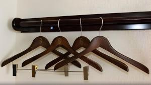 a bunch of wooden utensils hanging from a rack at Toyoko Inn Osaka Namba Nippombashi in Osaka