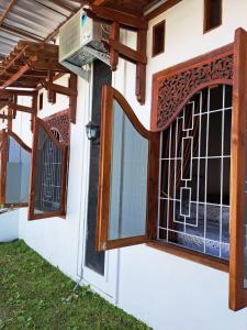 a house with a window and a gate at Omah Medina in Klaten