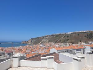 a view of a city from the roof of a building at Casa "Patota" - Nazaré - Alojamento Local in Nazaré