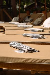 a row of pillows lined up on a table at Parco Ibiza, by Camping San Antonio est 1961 in San Antonio