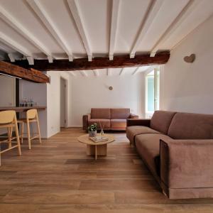 a living room with a couch and a table at Locanda Mimmo in Bergamo