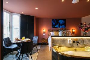a bathroom with a bed and a tub in a room at Craig Walk Suite in Bowness-on-Windermere