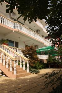 a large building with stairs in front of it at Villa Amadeus in Nesebar +13 photos