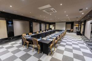 a conference room with a long table and chairs at Tryp By Wyndham Istanbul Sancaktepe in Istanbul