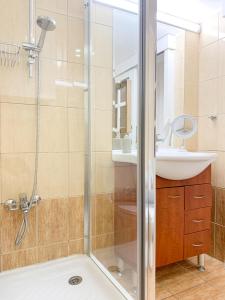 a bathroom with a shower and a sink at Central Larnaca Apartment in Larnaca