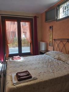 a bedroom with a bed with a tray on it at B&B Borgo dei Cedri in Pontecchio