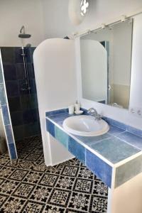 a bathroom with a sink and a mirror at La Finca de Véro in Barbate +39 photos