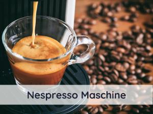 a cup of espresso machine next to a pile of coffee beans at Der Fuchsbau - 3 separate Blockhäuser - ruhige Lage - 50m bis zum Wald - eingezäunter Garten in Bad Sachsa +102 photos