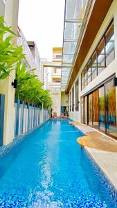 a swimming pool in the middle of a building at Ferra Premier by JG in Boracay