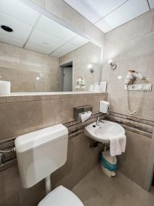 Koupelna v ubytování Hotel Unicornis