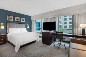 a hotel room with a bed and a television at Residence Inn by Marriott Boston Back Bay/Fenway in Boston