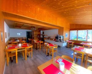 a dining room with wooden tables and wooden chairs at Hotel Sternen in Aarau