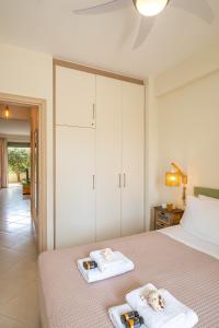 A bed or beds in a room at Chryssi myHome