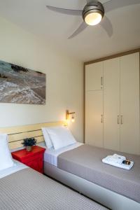 A bed or beds in a room at Chryssi myHome