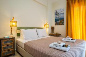 A bed or beds in a room at Chryssi myHome