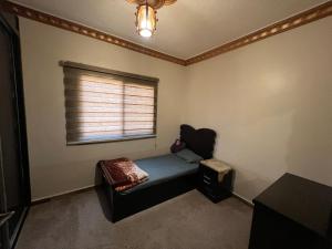 a small room with a couch and a window at Petra luxurious view house in Wadi Musa