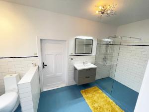 a bathroom with a sink and a toilet and a mirror at KreativKate in Breetz +19 photos
