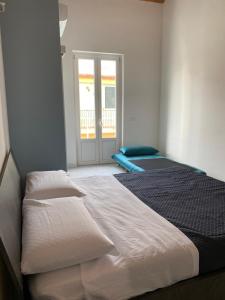 Кровать или кровати в номере Casa Monsù