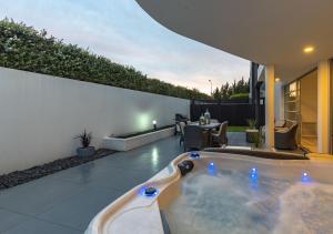 a hot tub in the backyard of a house at Cashmere Heights in Christchurch