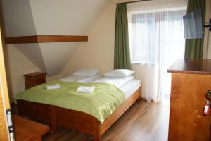Postel nebo postele na pokoji v ubytování Willa Ślązaczka