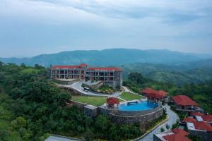 an aerial view of a resort with a swimming pool at Mahua Bagh Resort Kumbhalgarh in Kumbhalgarh