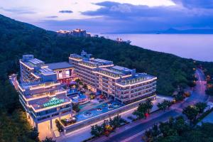 an aerial view of a hotel in a city at Wingate by Wyndham Sanya Luhuitou in Sanya