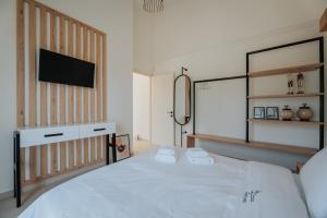 Voodi või voodid majutusasutuse Ponte Suites toas