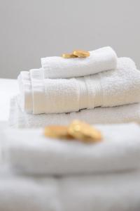 two white towels sitting on top of a table at Stylish and spacious Southampton stay in Southampton