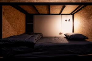 Postel nebo postele na pokoji v ubytování ANOU HOSTEL