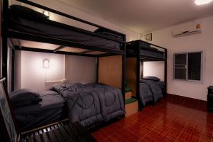Postel nebo postele na pokoji v ubytování ANOU HOSTEL