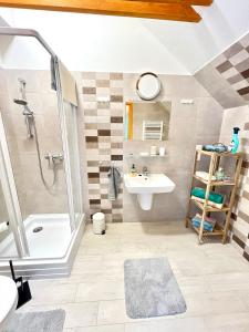 a bathroom with a shower and a sink at Barkland Apartman in Tarcal +18 photos